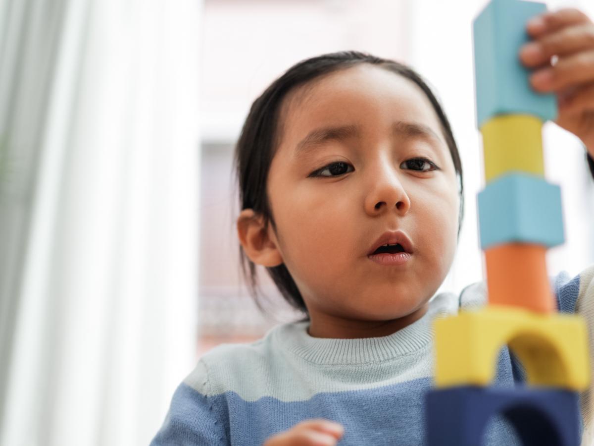 Child playing with building blocks.