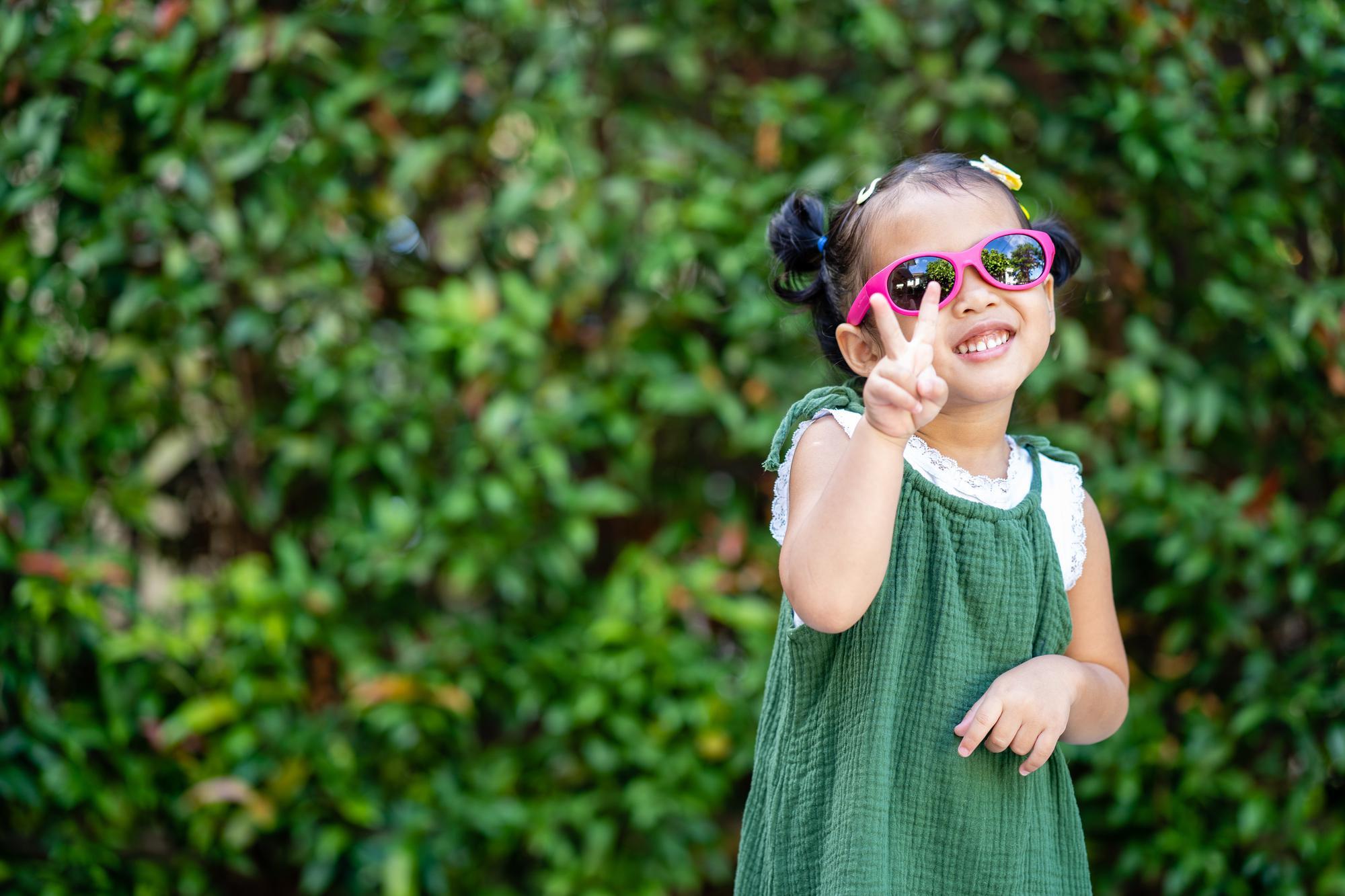 child wearing sun glasses