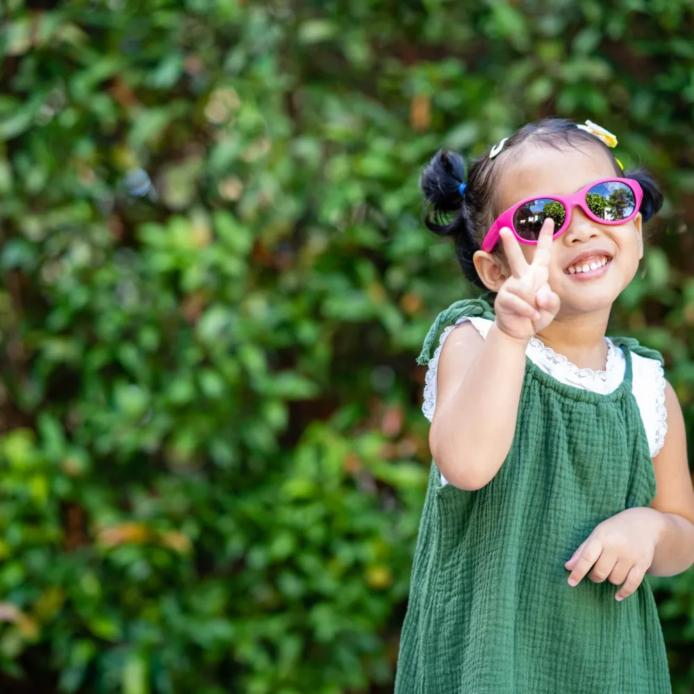 child wearing sun glasses